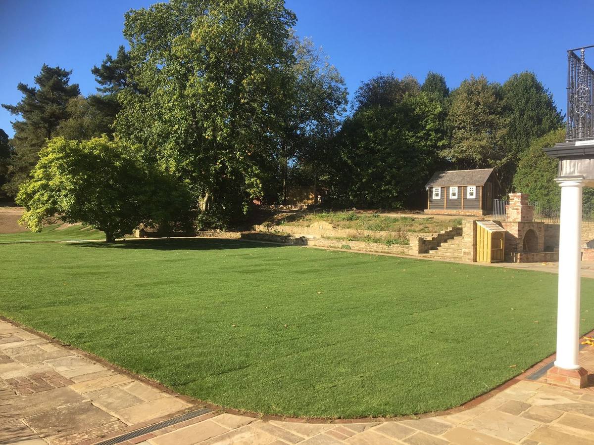 New lawn with retaining walls and steps
