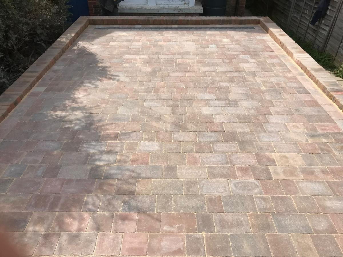 Block paved parking area with brick edging