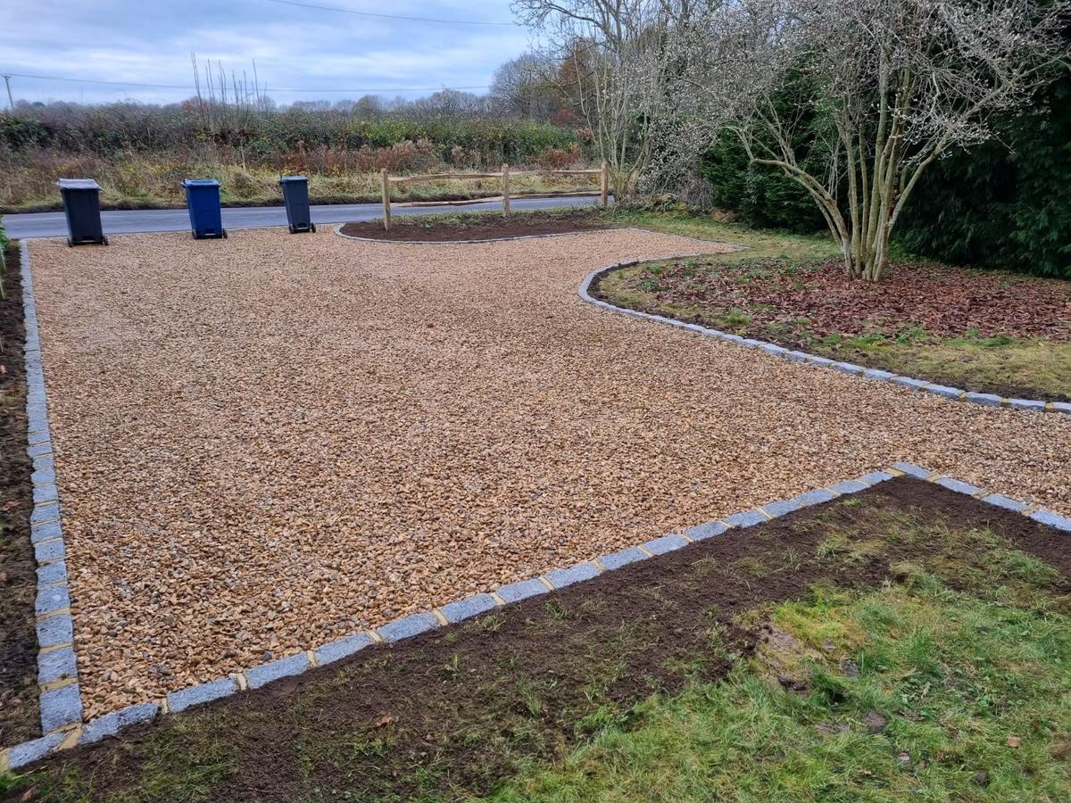 Gravel driveway with granite sett edging